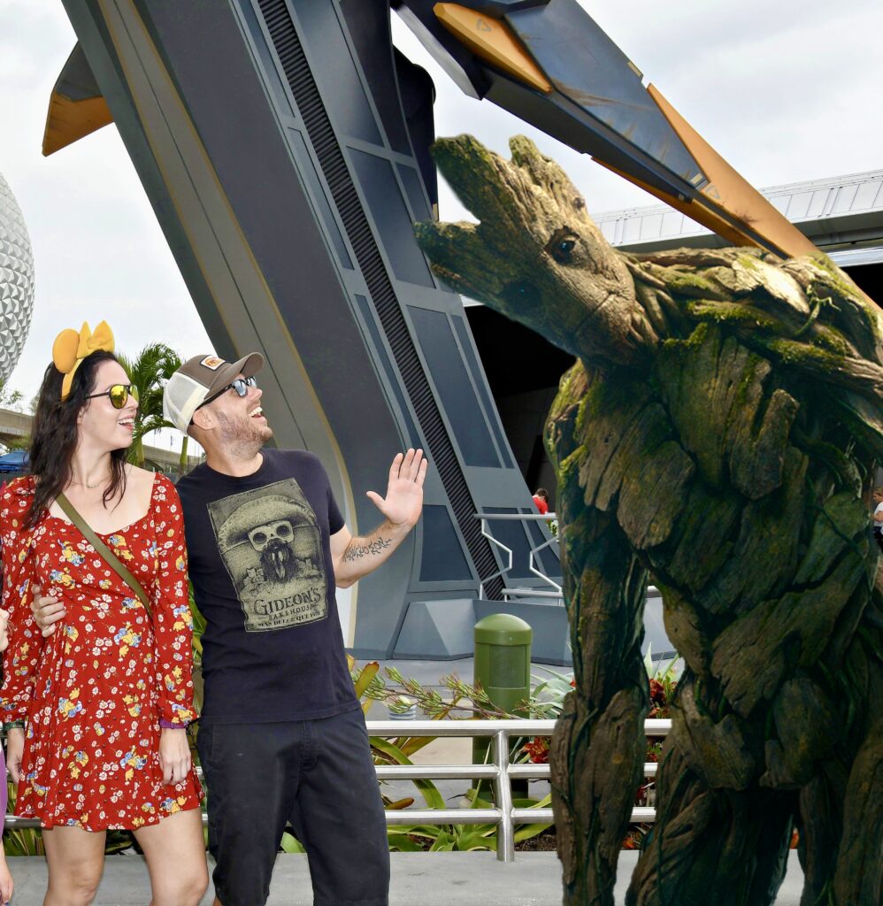 Pat and Jenn with Groot at Epcot in Walt Disney World outside Cosmic Rewind