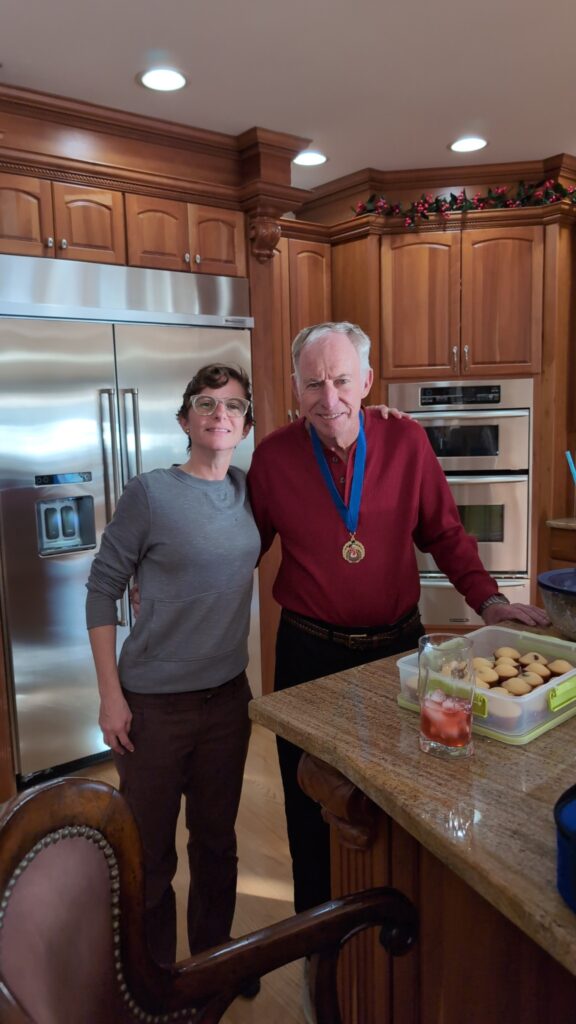 Y of the Chesapeake 5K - Andrea's dad wears her medal